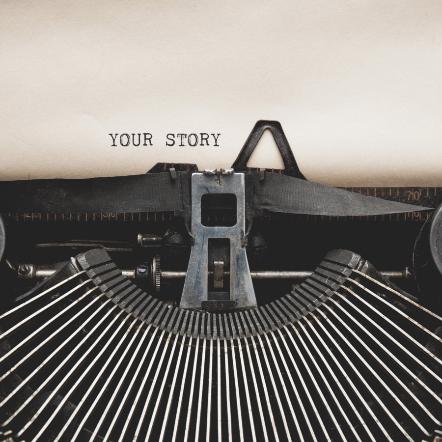 Typewriter with the words your story typed at the top of the page